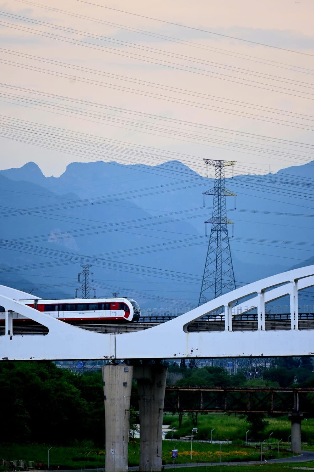A modern passenger train crossing an elevated viaduct, illustrating fast commercial insurance placement in as little as 48 hours